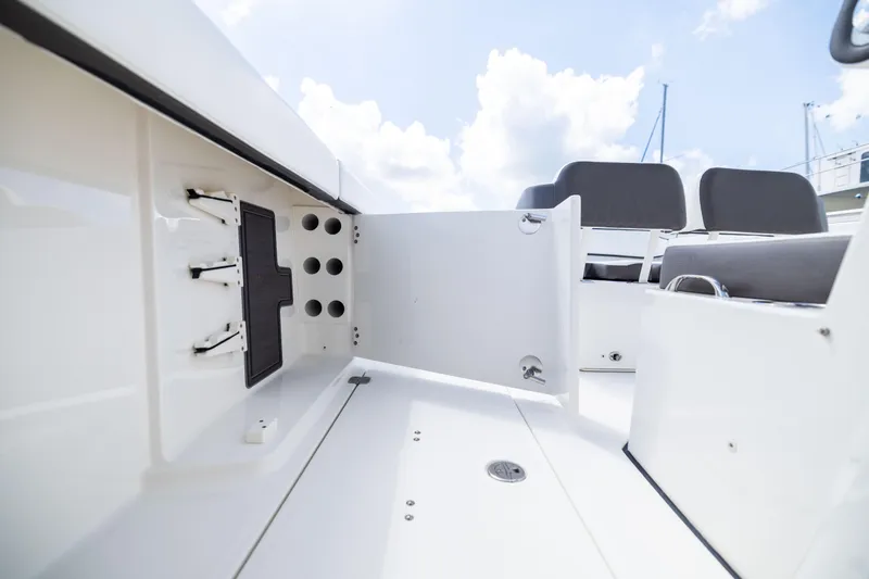 Slide: The Image of 2022 World Cat 400 CC-X boat interior with open storage compartment and seating. - 71