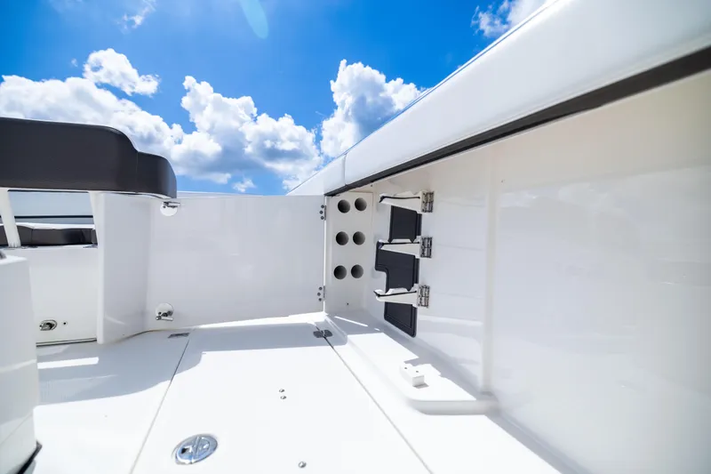 Slide: The Image of 2022 World Cat 400 CC-X boat interior with storage compartments under a bright blue sky. - 72