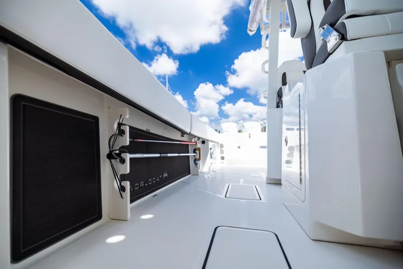 Slide: The Image of 2022 World Cat 400 CC-X boat interior with sleek design and clear blue sky. - 73