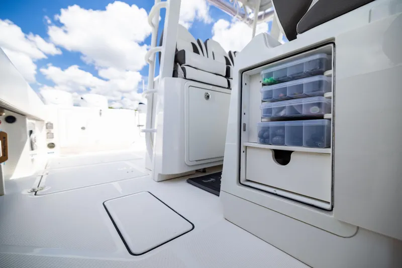 Slide: The Image of 2022 World Cat 400 CC-X boat interior with storage compartments and seating. - 75