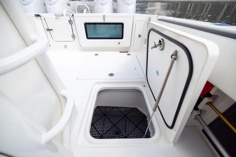 Slide: The Image of 2022 World Cat 400 CC-X boat interior with storage compartments and sleek design. - 79