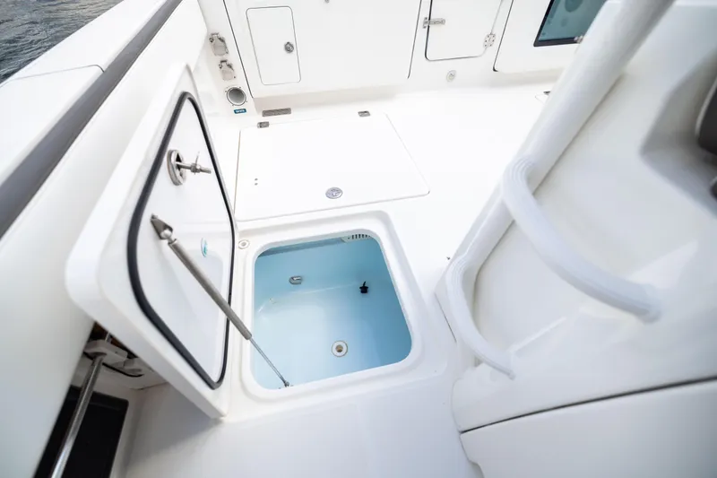 Slide: The Image of 2022 World Cat 400 CC-X boat interior with open storage compartment. - 80