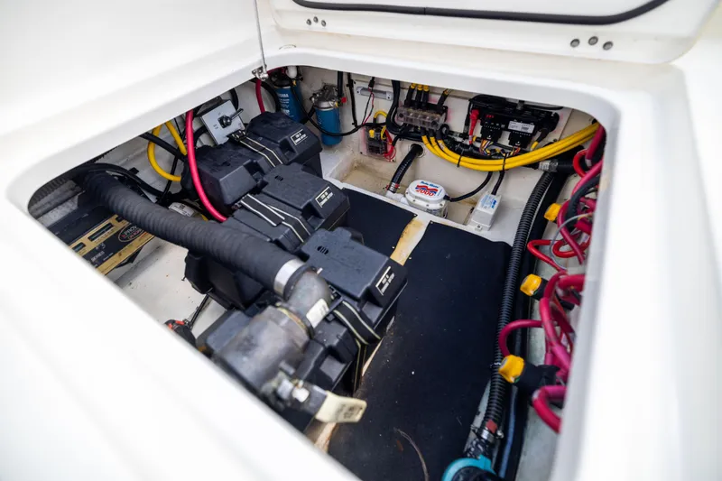 Slide: The Image of Engine compartment of 2022 World Cat 400 CC-X with visible wiring and components. - 82