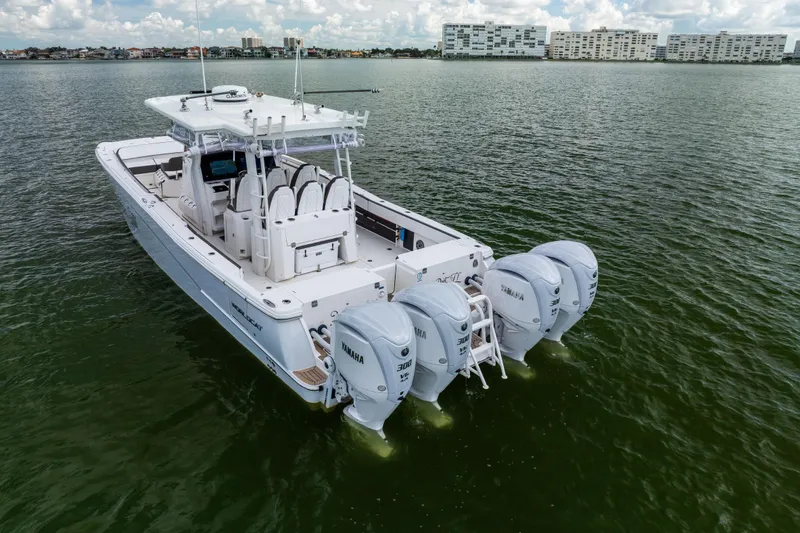 Slide: The Image of 2022 World Cat 400 CC-X boat with four Yamaha engines on calm water. - 9