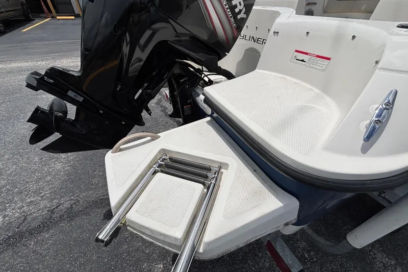 Slide: The Image of 2018 Bayliner Element E16 boat with outboard motor and swim platform ladder. - 18