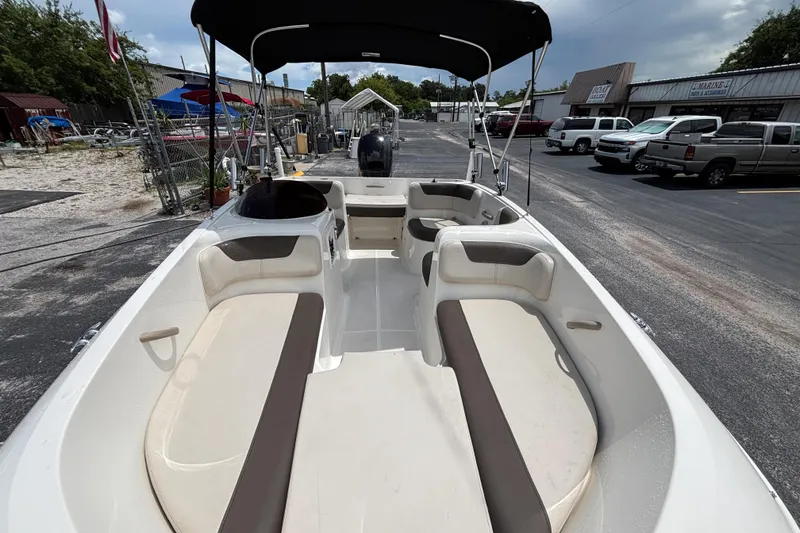 Slide: The Image of 2018 Bayliner Element E16 boat with spacious seating, parked outdoors. - 9