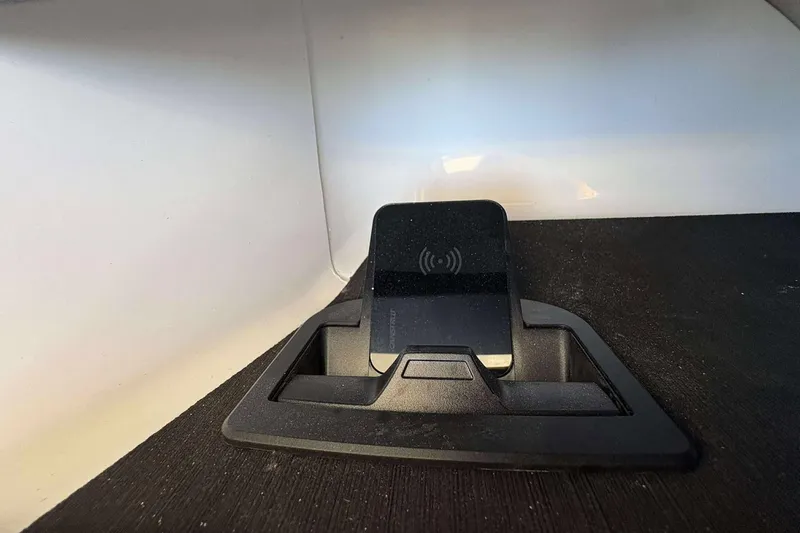 Slide: The Image of Wireless charging station in 2026 Monterey 27 Elite boat interior. - 15