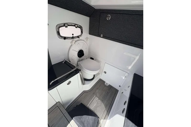 Slide: The Image of 2026 Monterey 27 Elite boat interior with modern bathroom amenities. - 25