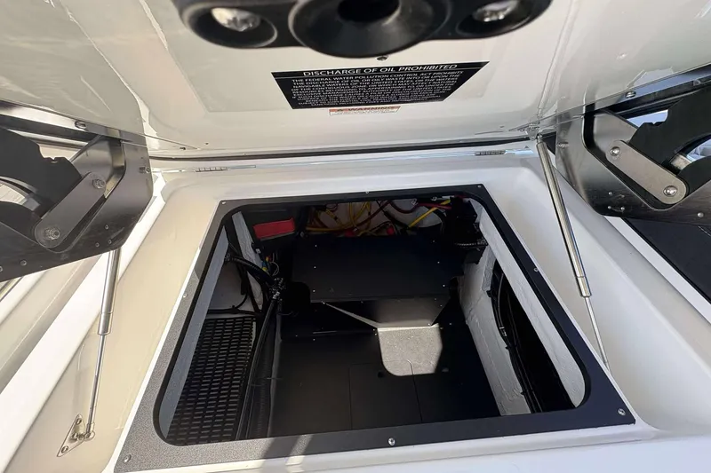 Slide: The Image of Open engine compartment of 2026 Monterey 27 Elite boat, showcasing interior components. - 26