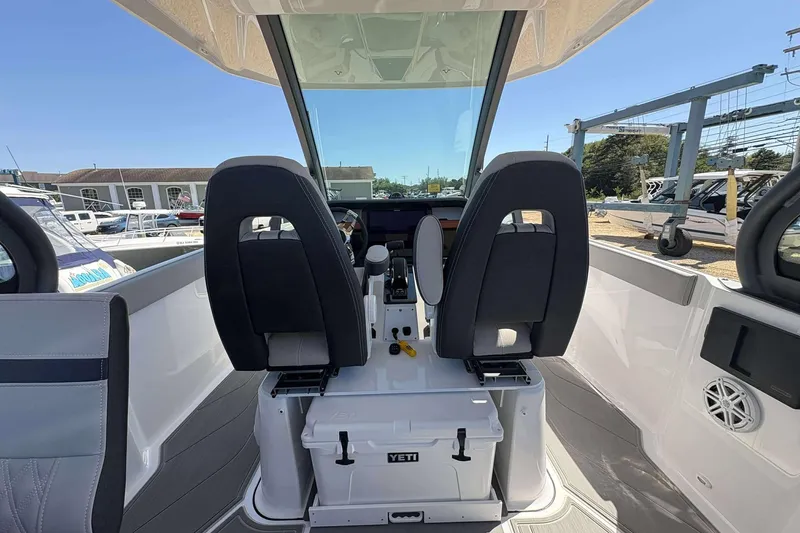 Slide: The Image of 2026 Monterey 27 Elite boat interior with dual seats and modern dashboard. - 9