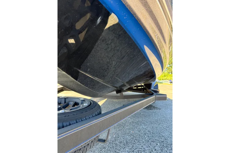 Slide: The Image of 2021 Skeeter FXR21 Apex boat on trailer, close-up of hull and wheel. - 18