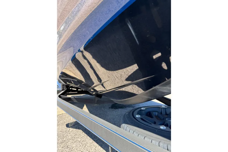 Slide: The Image of 2021 Skeeter FXR21 Apex boat hull and trailer detail in sunlight. - 19