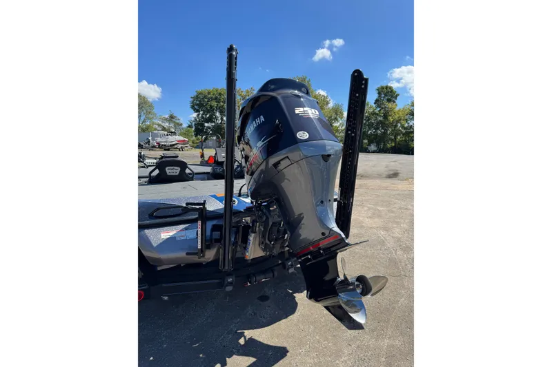 Slide: The Image of 2021 Skeeter FXR21 Apex boat with Yamaha 250 engine, parked outdoors. - 21