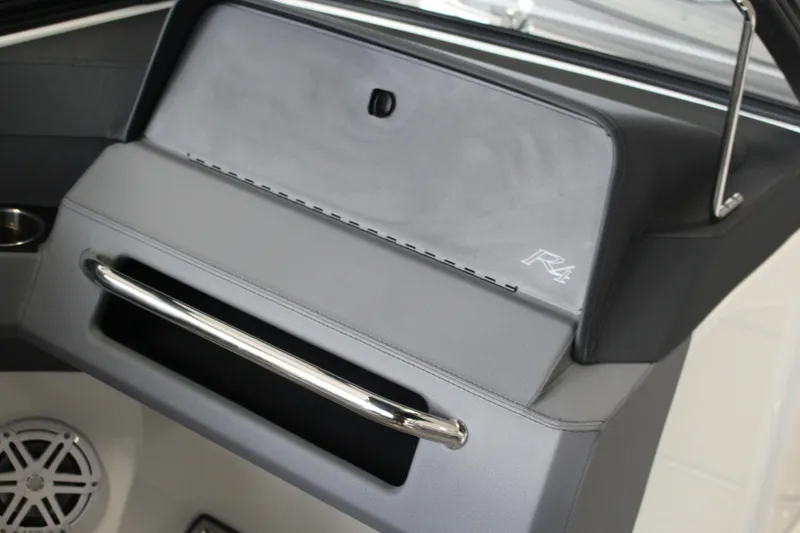 Slide: The Image of 2025 Cobalt R4 boat interior with sleek dashboard and chrome handle. - 10