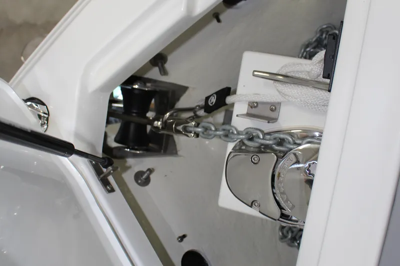 Slide: The Image of Anchor chain mechanism on 2025 Cobalt R4 boat, featuring polished metal components. - 12