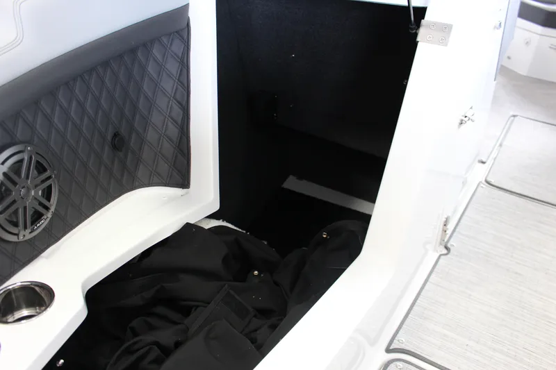Slide: The Image of Interior of 2025 Cobalt R4 boat showing storage area and speaker. - 14
