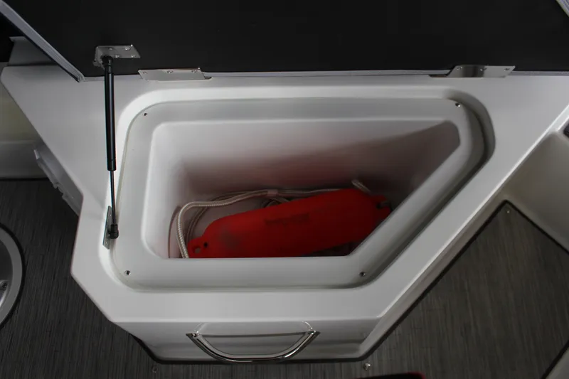 Slide: The Image of Storage compartment in 2025 Cobalt R4 boat with red buoy and rope. - 15