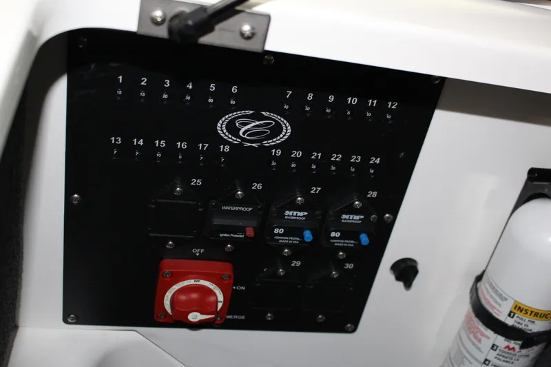 Slide: The Image of Control panel of 2025 Cobalt R4 boat with switches and fire extinguisher. - 17