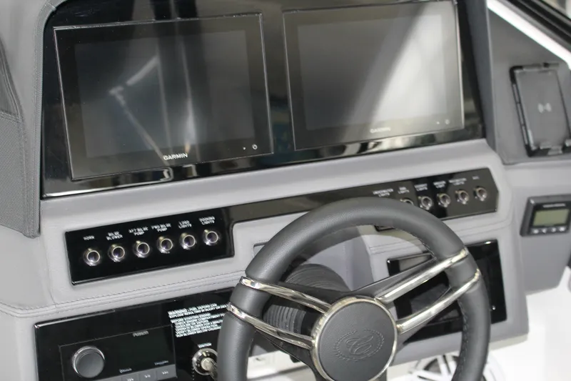 Slide: The Image of 2025 Cobalt R4 dashboard with dual Garmin screens and modern controls. - 6