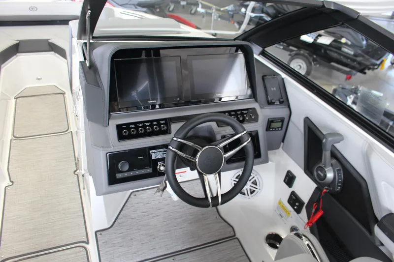 Slide: The Image of 2025 Cobalt R4 boat dashboard with dual screens and modern controls. - 7