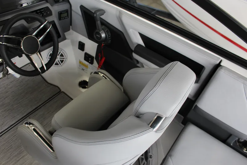 Slide: The Image of Interior of 2025 Cobalt R4 boat featuring steering wheel and modern controls. - 8