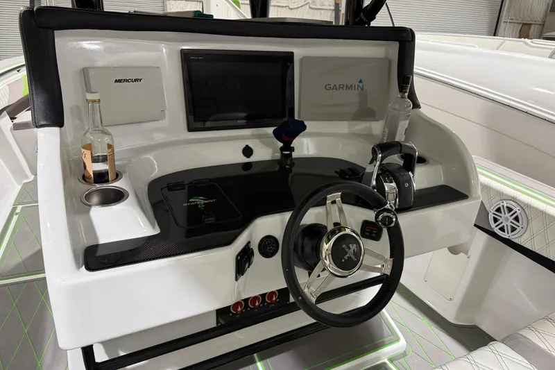 Slide: The Image of Helm of 2017 Statement 350 Open boat with Garmin and Mercury controls. - 10