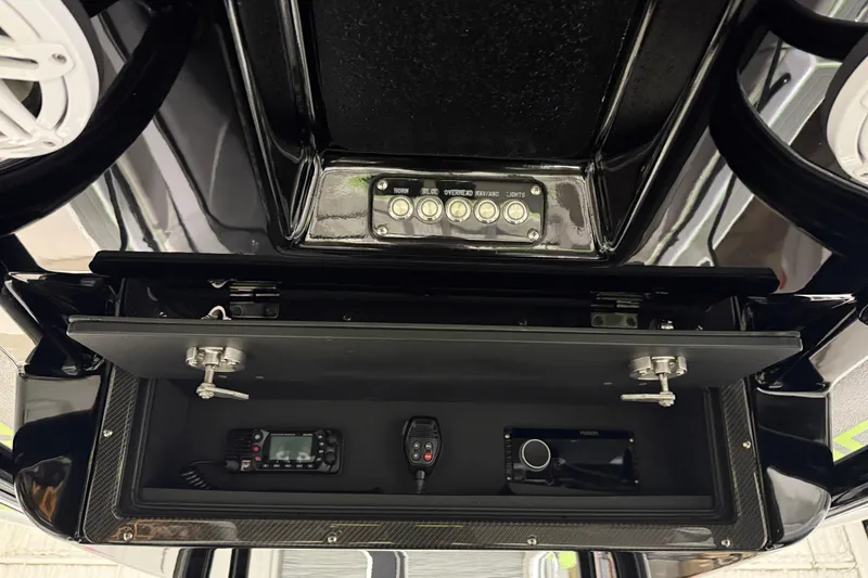 Slide: The Image of Control panel and electronics in a 2017 Statement 350 Open boat. - 11