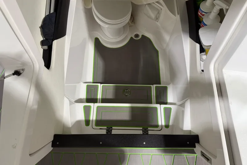 Slide: The Image of Interior of a 2017 Statement 350 Open boat, featuring a compact bathroom area. - 15