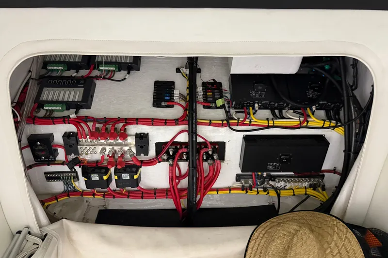 Slide: The Image of Electrical wiring and components inside a 2017 Statement 350 Open boat. - 21