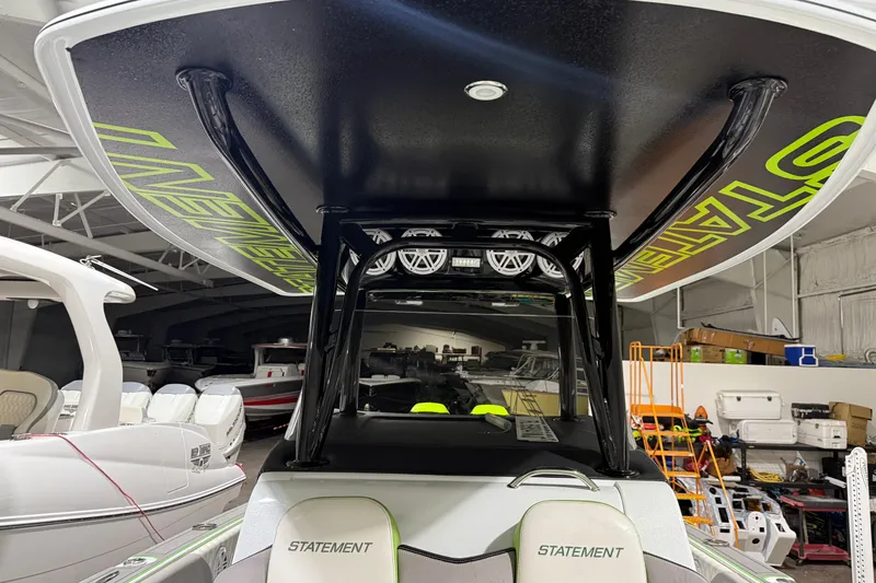Slide: The Image of 2017 Statement 350 Open boat interior with custom seating and overhead design in a showroom. - 22