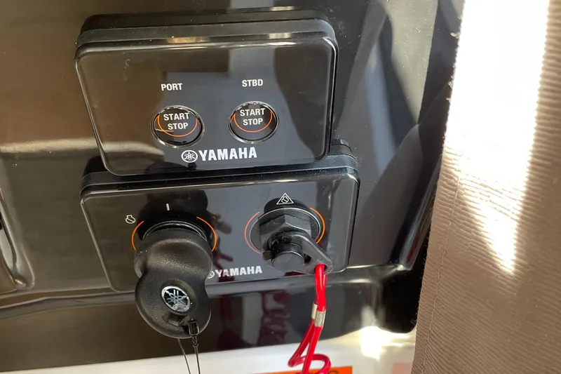 Slide: The Image of Control panel of a 2020 Jeanneau NC 895 with Yamaha start/stop buttons. - 21
