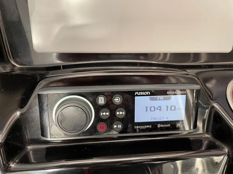 Slide: The Image of Fusion marine stereo system on Jeanneau NC 895, 2020 model, displaying FM 104.1 MHz. - 24