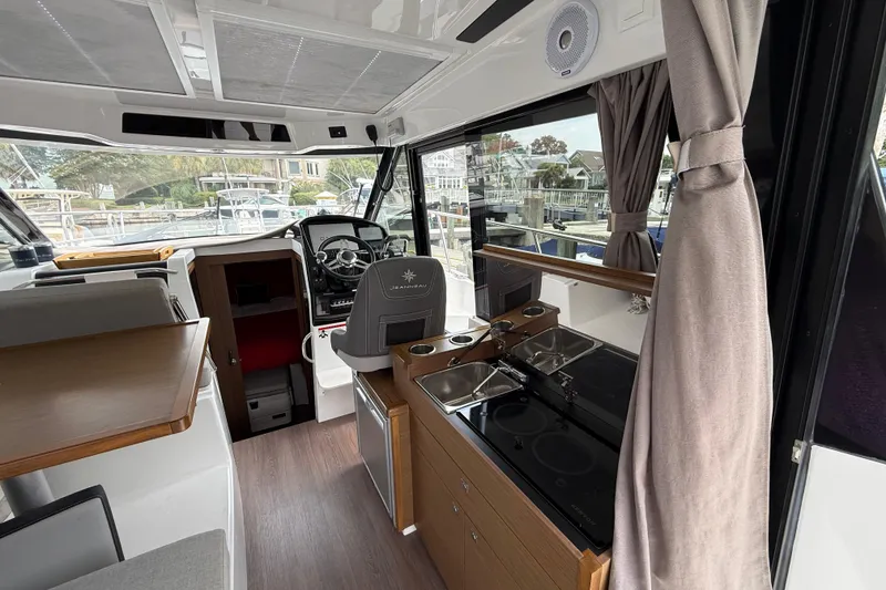 Slide: The Image of Interior of 2020 Jeanneau NC 895 boat with modern helm and kitchenette. - 29