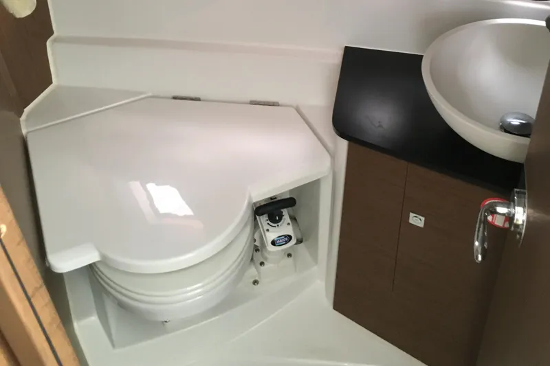 Slide: The Image of 2020 Jeanneau NC 895 bathroom with compact toilet and modern sink design. - 38