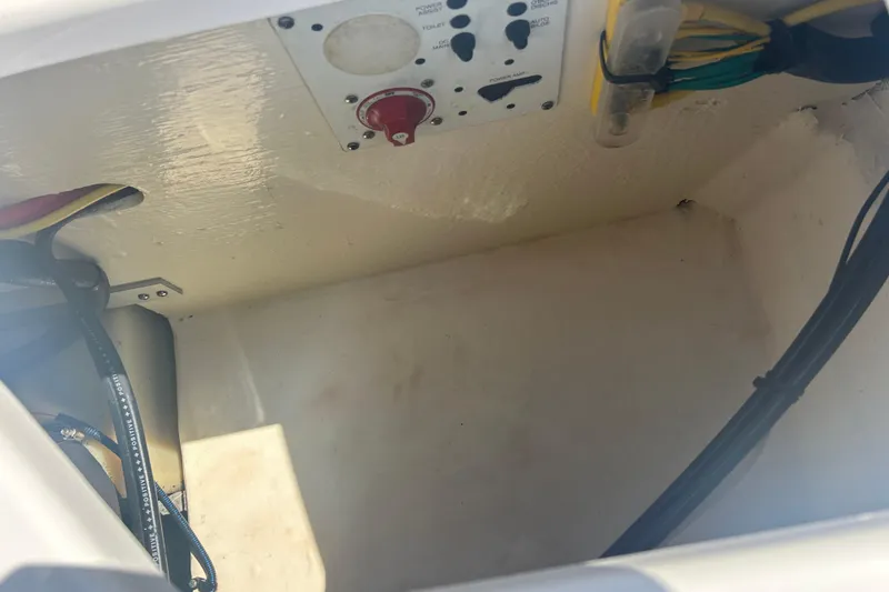 Slide: The Image of 2016 Chaparral 230 Suncoast boat interior with steering wheel and seating. - 10