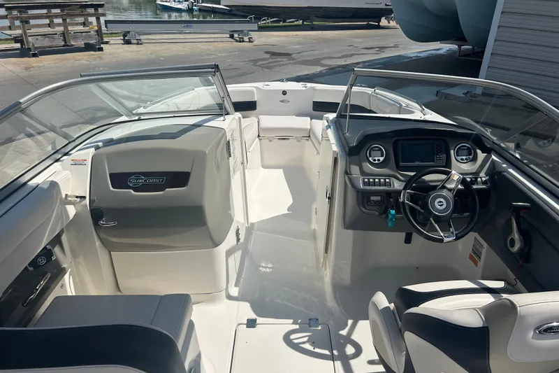 Slide: The Image of Interior view of 2016 Chaparral 230 Suncoast boat compartment with wiring and control panel. - 11