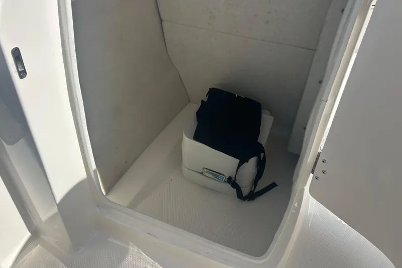 Slide: The Image of 2016 Chaparral 230 Suncoast boat interior with Suncoast logo on dashboard. - 14