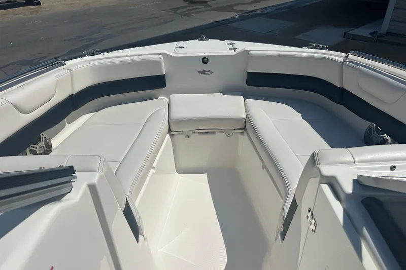 Slide: The Image of Interior storage compartment of 2016 Chaparral 230 Suncoast boat with a cooler and bag. - 15