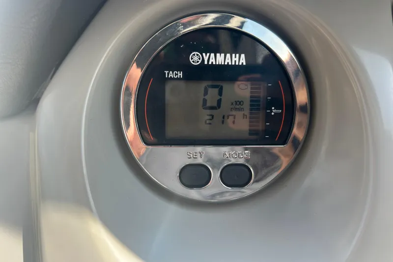 Slide: The Image of 2016 Chaparral 230 Suncoast boat interior with seating and Yamaha 200 engine. - 19