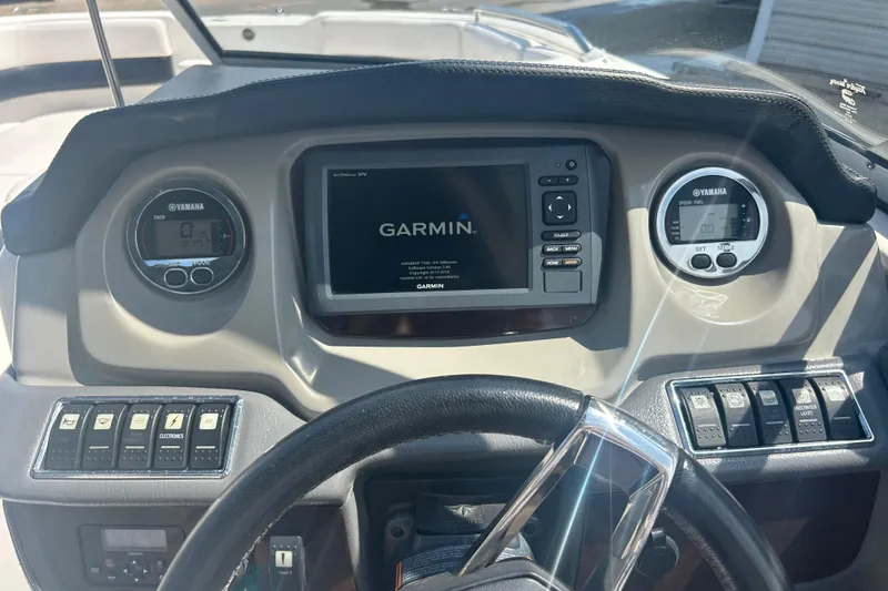 Slide: The Image of Yamaha tachometer on 2016 Chaparral 230 Suncoast boat dashboard, displaying 217 hours. - 20