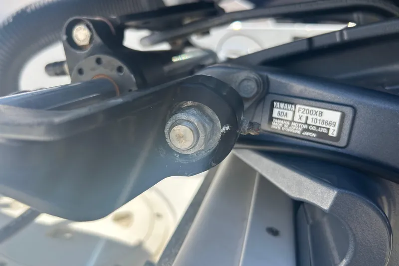 Slide: The Image of Dashboard controls of a 2016 Chaparral 230 Suncoast boat, featuring various switches. - 25