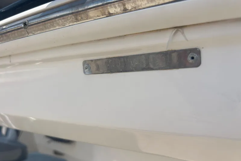 Slide: The Image of Close-up of a Yamaha F200XB engine part on a 2016 Chaparral 230 Suncoast boat. - 26