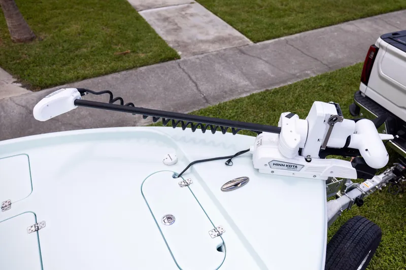 Slide: The Image of 2024 Yellowfin 24 CE boat with Minn Kota trolling motor on trailer. - 22