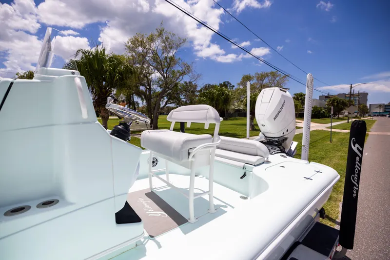 Slide: The Image of 2024 Yellowfin 24 CE boat with Mercury engine, parked on a sunny day. - 9