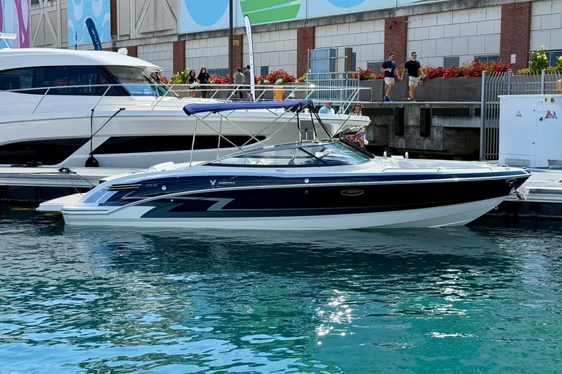The Image of 2024 Formula 270 Bowrider boat docked in a marina, featuring sleek design and modern aesthetics. - 0
