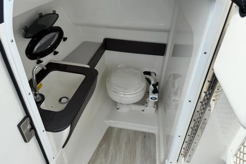 Slide: The Image of 2024 Formula 270 Bowrider interior bathroom with sink and toilet. - 15