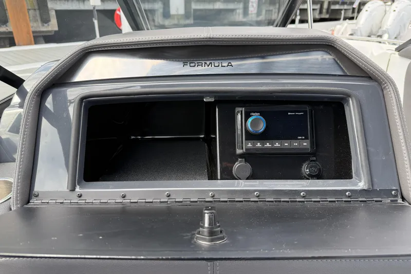 Slide: The Image of 2024 Formula 270 Bowrider dashboard with Clarion audio system and USB ports. - 17