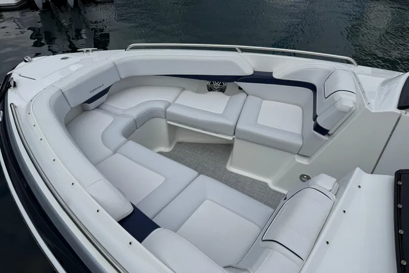 Slide: The Image of 2024 Formula 270 Bowrider boat interior with luxurious white seating and sleek design. - 2