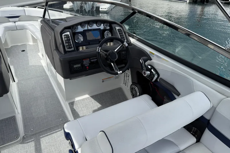Slide: The Image of 2024 Formula 270 Bowrider cockpit with modern controls and luxurious seating. - 4