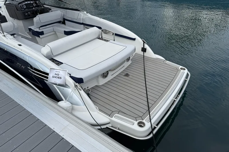 Slide: The Image of 2024 Formula 270 Bowrider boat docked, featuring spacious seating and "No Shoes" sign. - 7